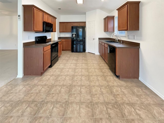 kitchen with sink and black appliances