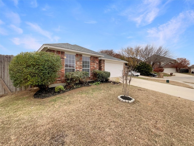 ranch-style home with a garage and a front lawn