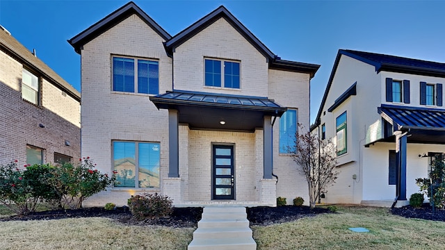 view of front of house with a front lawn