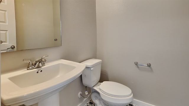 bathroom with sink and toilet