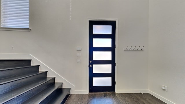 foyer entrance featuring dark hardwood / wood-style floors