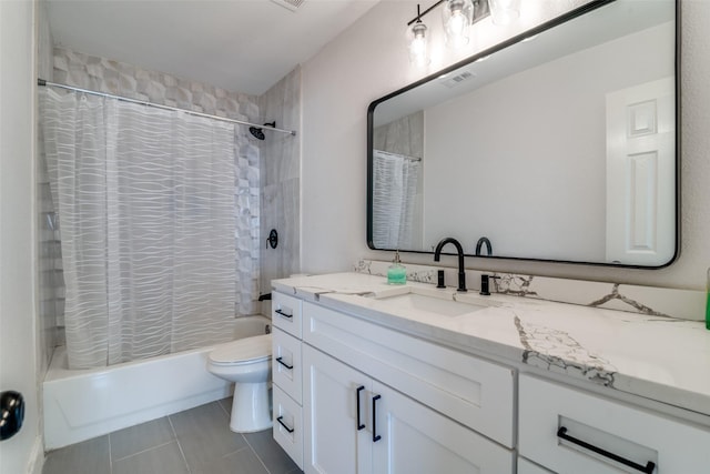 full bathroom featuring vanity, shower / bathtub combination with curtain, tile patterned floors, and toilet