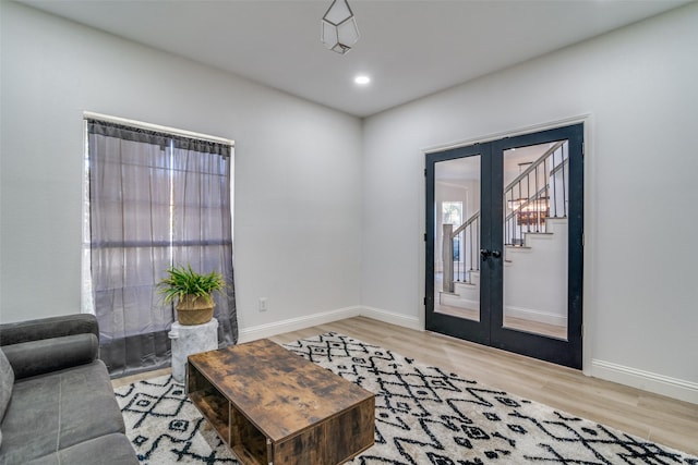 entryway with french doors and wood-type flooring