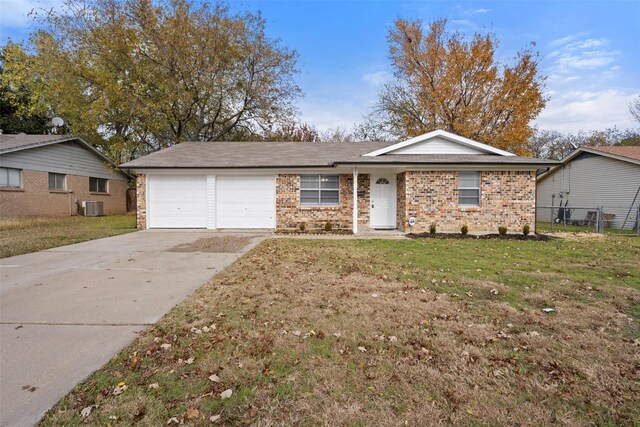 single story home with a front yard, a garage, and central AC unit