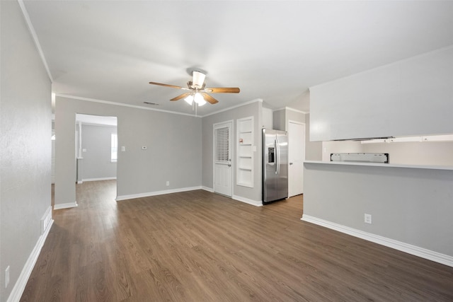 unfurnished living room with dark hardwood / wood-style flooring, ceiling fan, and crown molding