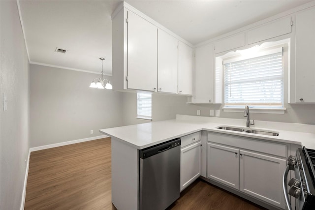 kitchen featuring kitchen peninsula, hanging light fixtures, white cabinets, and stainless steel appliances