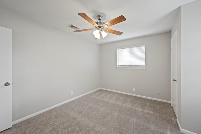 carpeted empty room featuring ceiling fan