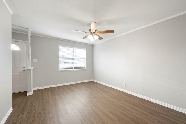 unfurnished room featuring dark hardwood / wood-style flooring, ceiling fan, and ornamental molding