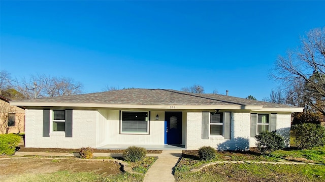 single story home featuring covered porch