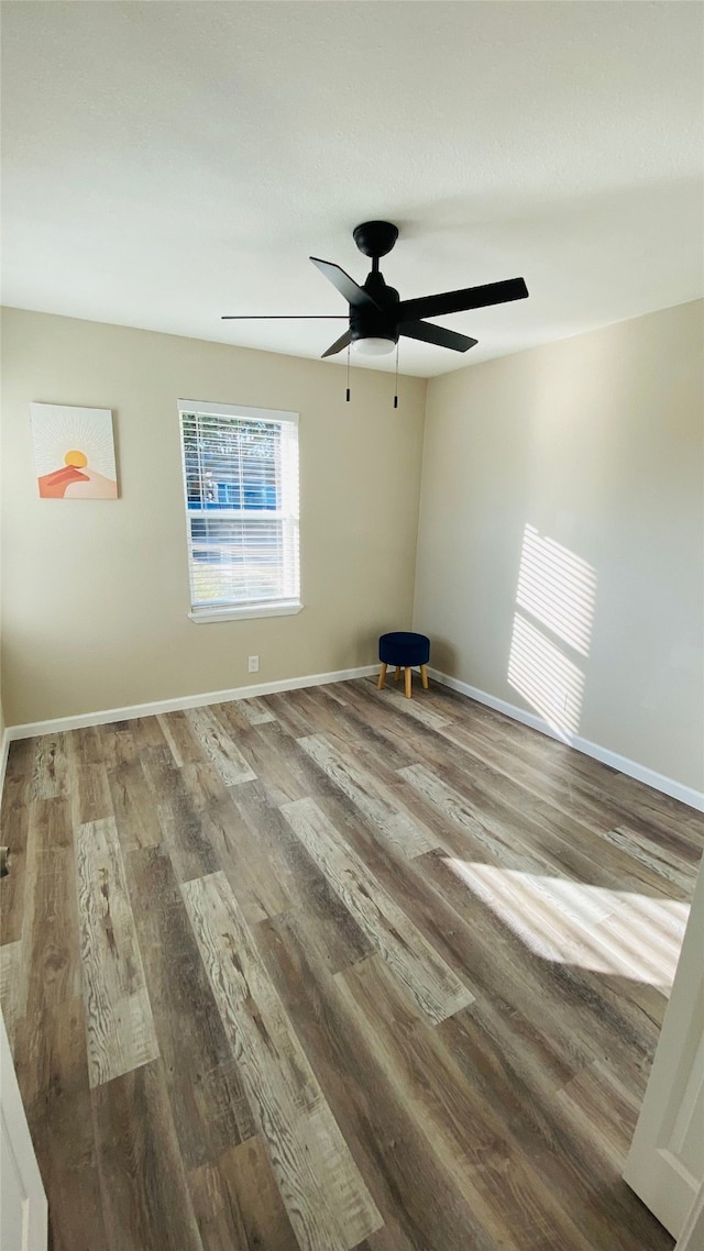 spare room featuring ceiling fan and wood-type flooring