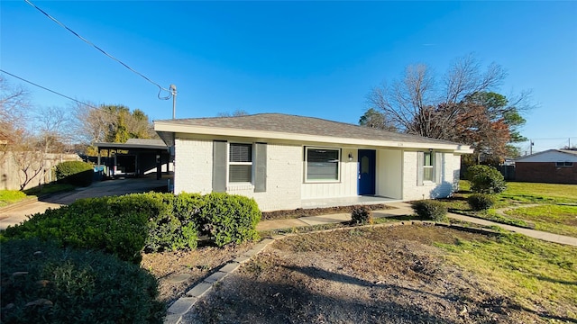 view of front of home featuring a carport