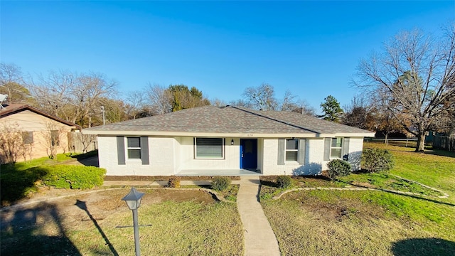 single story home with a front yard