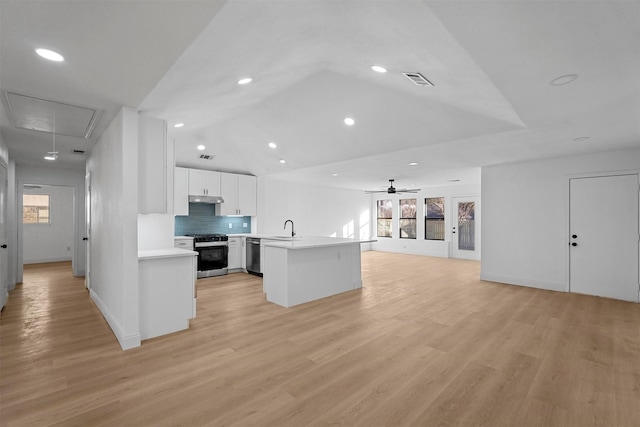 kitchen with ceiling fan, white cabinetry, appliances with stainless steel finishes, and light hardwood / wood-style flooring