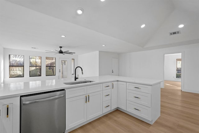 kitchen featuring dishwasher, sink, ceiling fan, light wood-type flooring, and white cabinetry