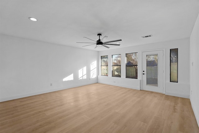 spare room featuring ceiling fan and light hardwood / wood-style floors