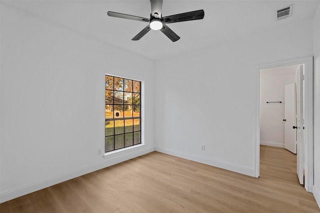 spare room featuring ceiling fan and light hardwood / wood-style flooring