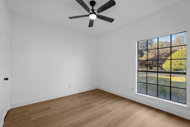 spare room featuring ceiling fan and light hardwood / wood-style flooring