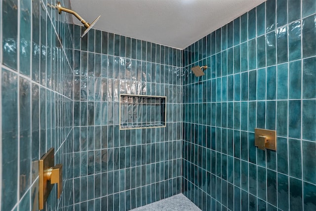 bathroom featuring a tile shower