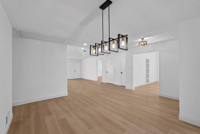 unfurnished dining area featuring light wood-type flooring