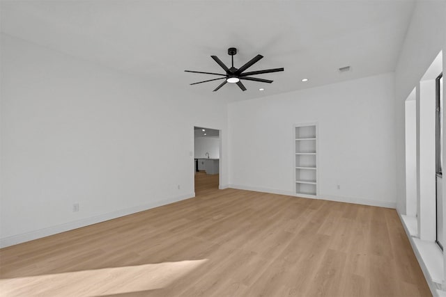 unfurnished bedroom with ceiling fan and light hardwood / wood-style floors