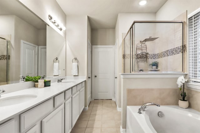 bathroom featuring tile patterned flooring, vanity, and independent shower and bath