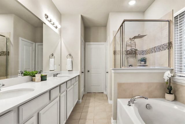 2053 Barx Dr, Little Elm, TX 75068 - full bathroom with tile patterned flooring, a shower stall, a garden tub, and double vanity