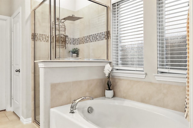 bathroom featuring separate shower and tub and tile patterned flooring