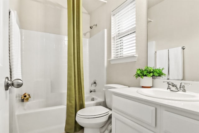 full bathroom with vanity, toilet, and shower / tub combo with curtain