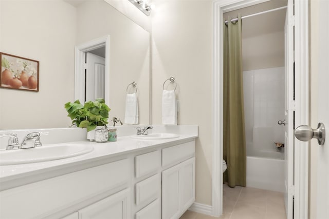 full bathroom featuring tile patterned floors, vanity, shower / bath combination with curtain, and toilet