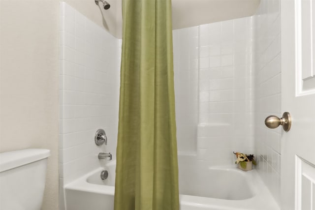 bathroom featuring toilet and shower / bathtub combination with curtain