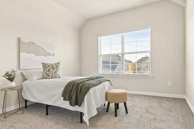 carpeted bedroom with vaulted ceiling