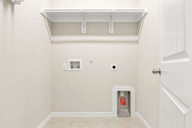 laundry room featuring hookup for an electric dryer, light tile patterned flooring, gas dryer hookup, and hookup for a washing machine