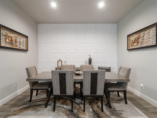 dining room with dark hardwood / wood-style flooring