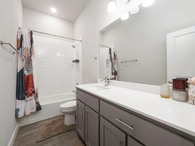 full bathroom featuring toilet, wood-type flooring, vanity, and shower / tub combo with curtain