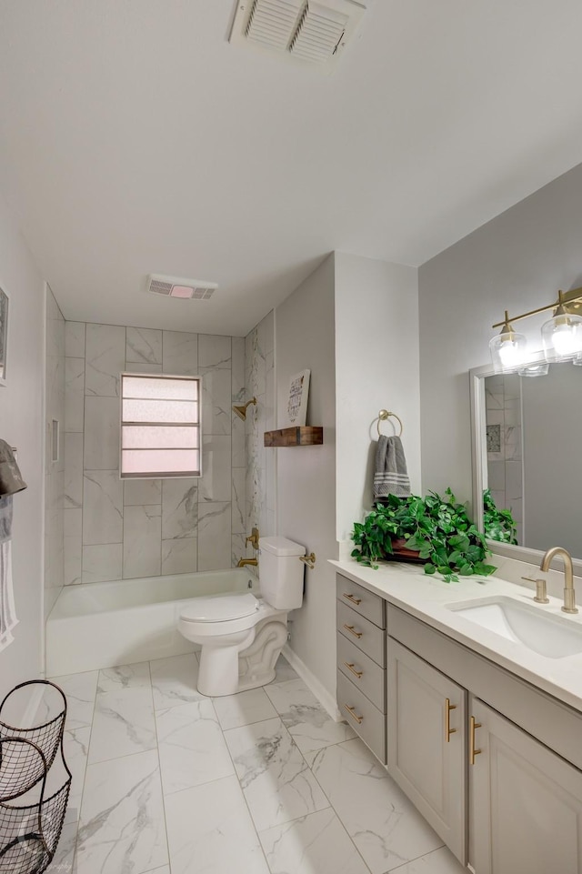 full bathroom featuring vanity, toilet, and tiled shower / bath