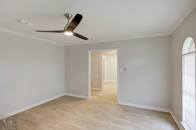 spare room with light wood-type flooring, ceiling fan, and ornamental molding