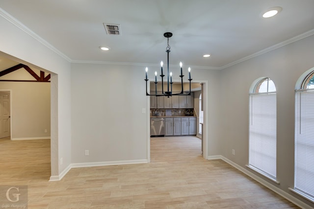 unfurnished dining area with crown molding, light hardwood / wood-style floors, and a notable chandelier