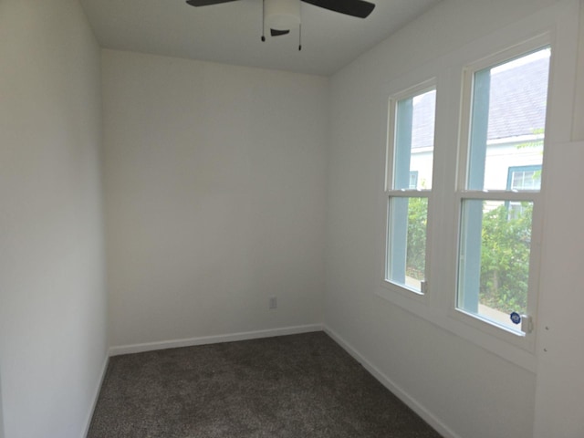 carpeted empty room featuring ceiling fan and a healthy amount of sunlight