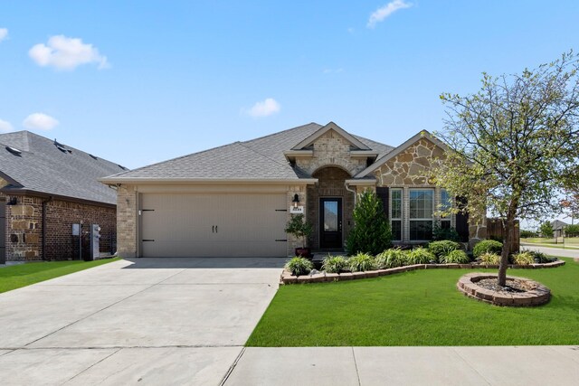 view of front of house with a front lawn and a garage