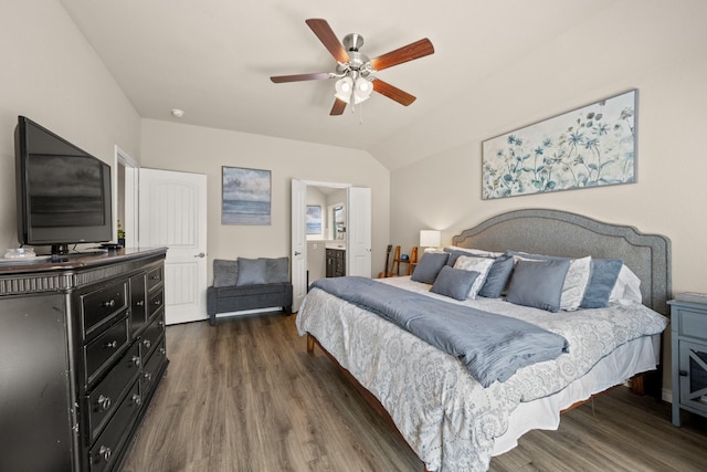 bedroom featuring ensuite bathroom, dark hardwood / wood-style flooring, ceiling fan, and lofted ceiling