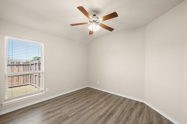 unfurnished room featuring hardwood / wood-style floors, vaulted ceiling, and ceiling fan