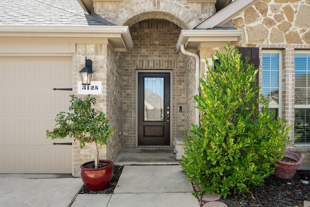 doorway to property featuring a garage