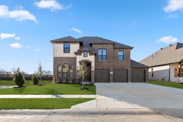 view of front facade with a front lawn and a garage