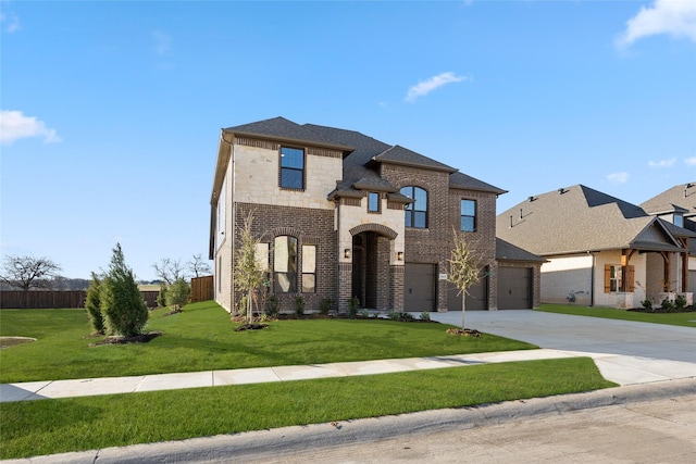 view of front of home with a front yard and a garage