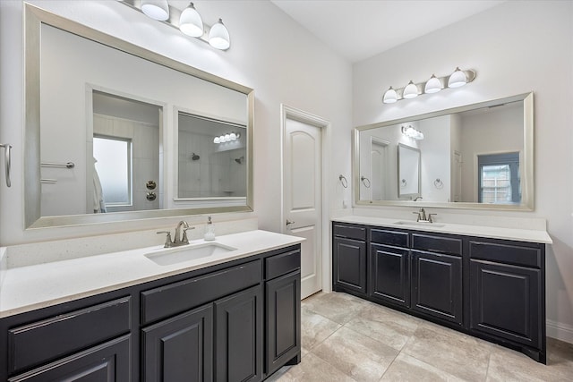 bathroom featuring vanity, tile patterned floors, and walk in shower