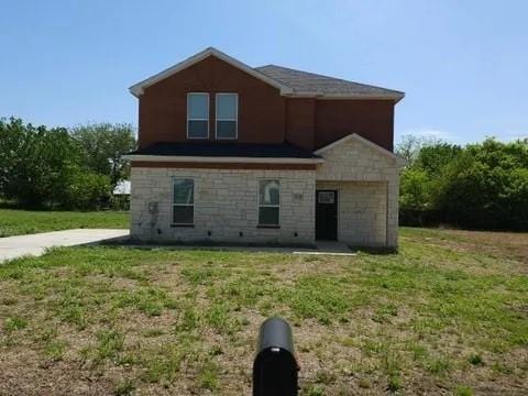 rear view of house with a lawn