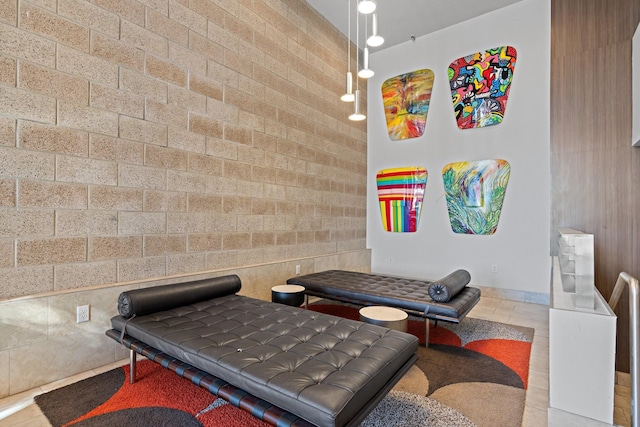 interior space with light tile patterned floors and tile walls