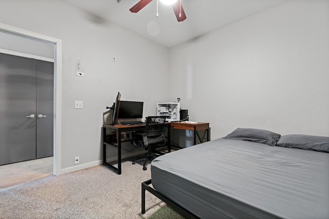 bedroom with light wood-type flooring, a closet, and ceiling fan