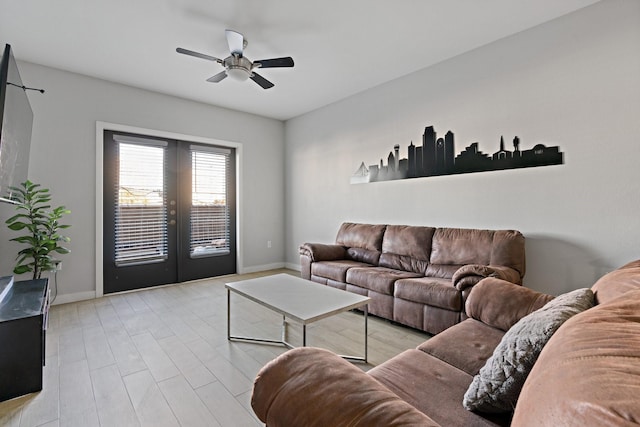 living room with french doors, light hardwood / wood-style floors, and ceiling fan