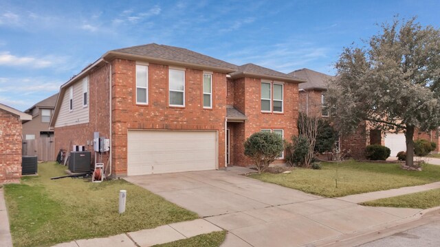 view of front of home with a garage and cooling unit